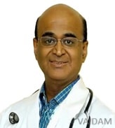 Dr. Neville Solomon