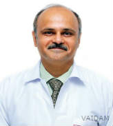 Dr. Manmohan Kamat