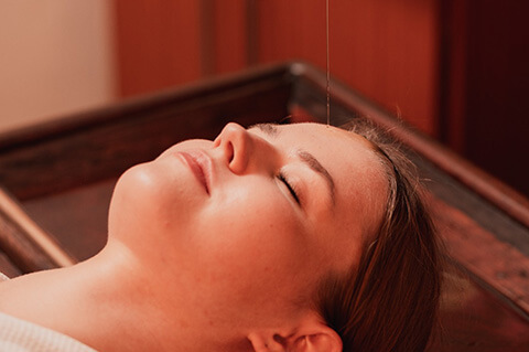 Calming Ayurvedic therapy session at Olive Creek Wellness Mauritius for burnout recovery