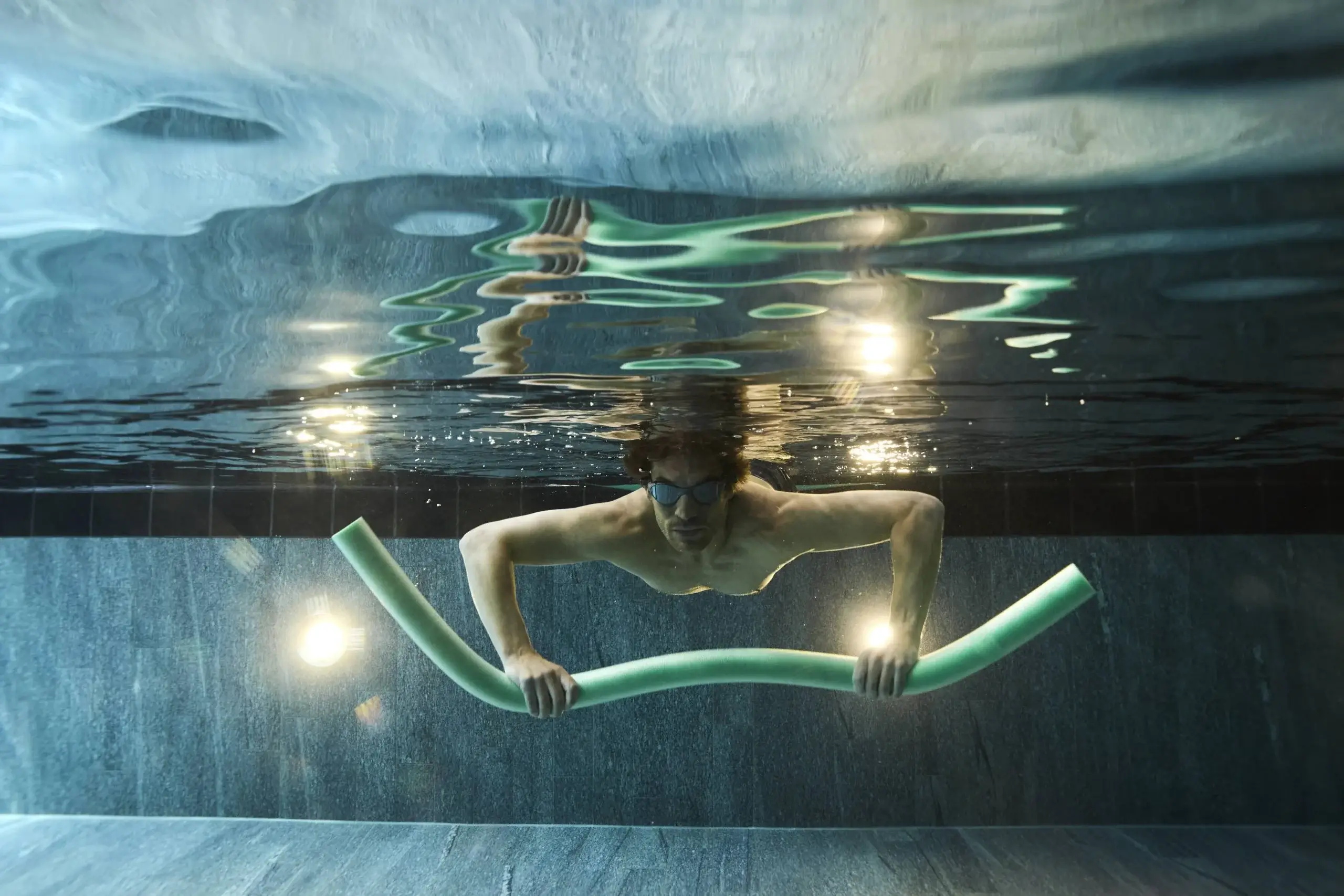Man swimming in Lake Lucerne during Prevention and Ageing Well programme at Chenot Palace Weggis