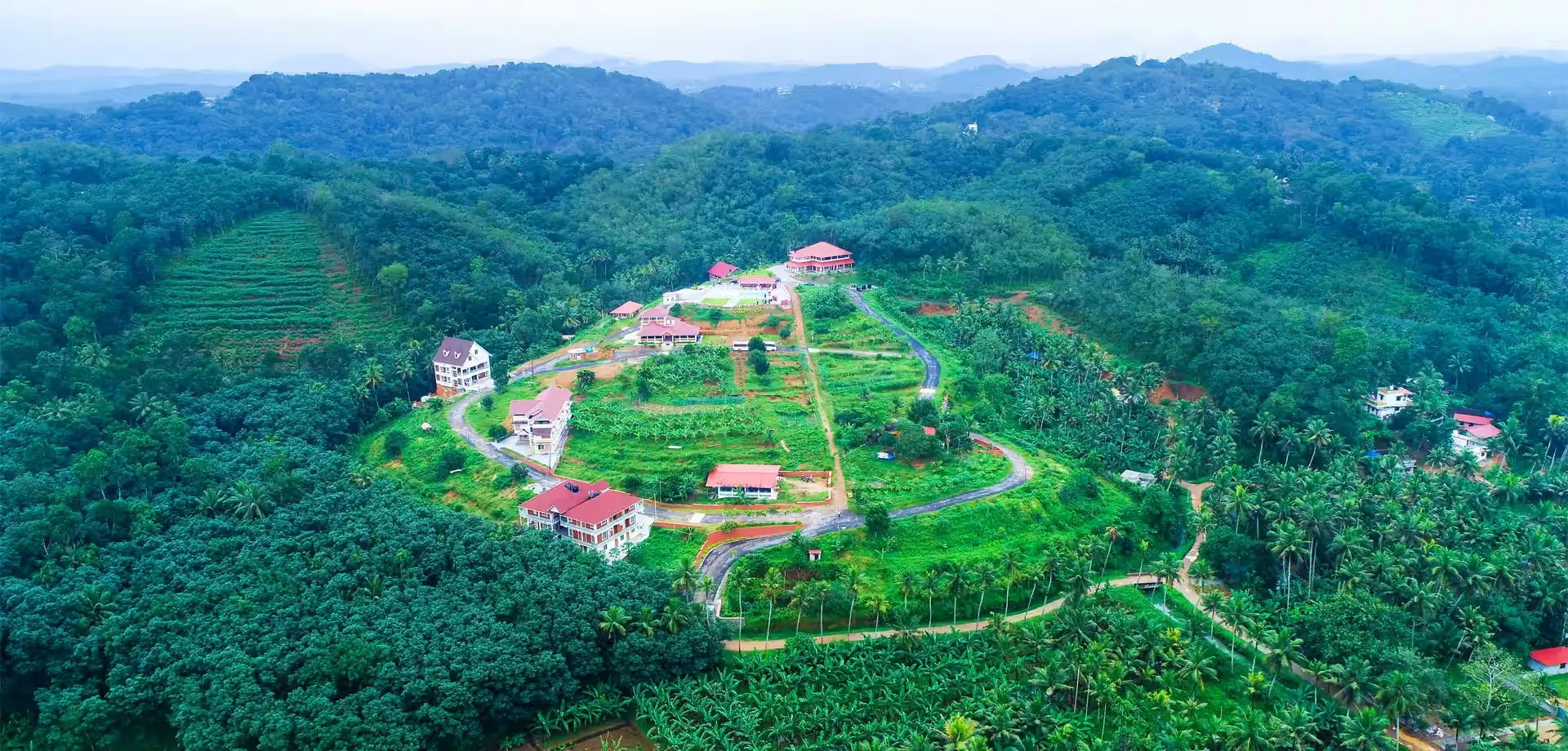 Accommodation and healing spaces at Indimasi Healing Village Kerala