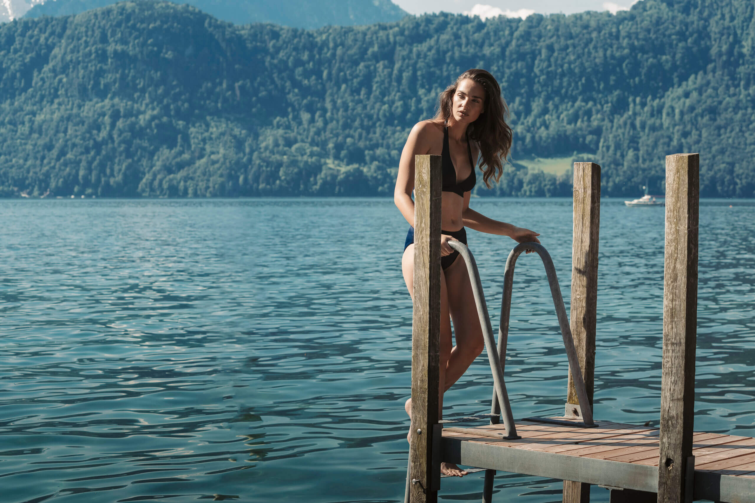 Indoor swimming pool with panoramic Lake Lucerne view at Chenot Palace Weggis