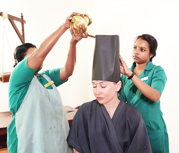 Shirodhara therapy for stress relief at Shinshiva near Kovalam