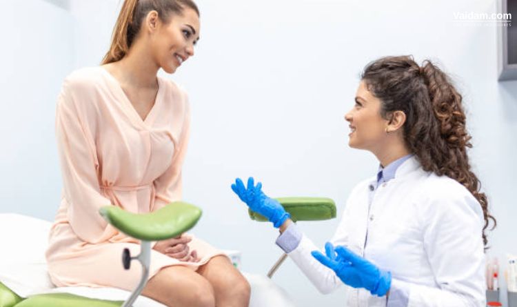 Patient Consulting With Doctor